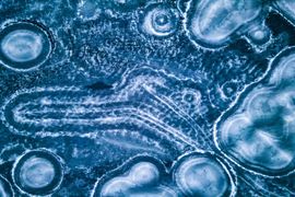 aerial-view-of-frozen-lake-with-ice-patterns-2025-02-10-07-48-37-utc -1-